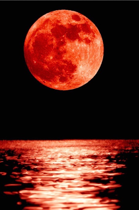 red moon reflected on water